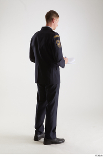 Sam Atkins Fireman in Uniform standing whole body writing notes…